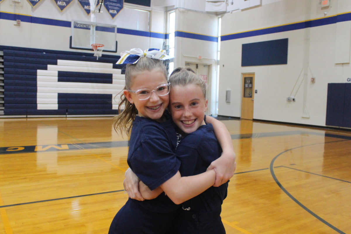 4th graders, Hatilynn Hull and Claire Schmitz smile together for a picture.
