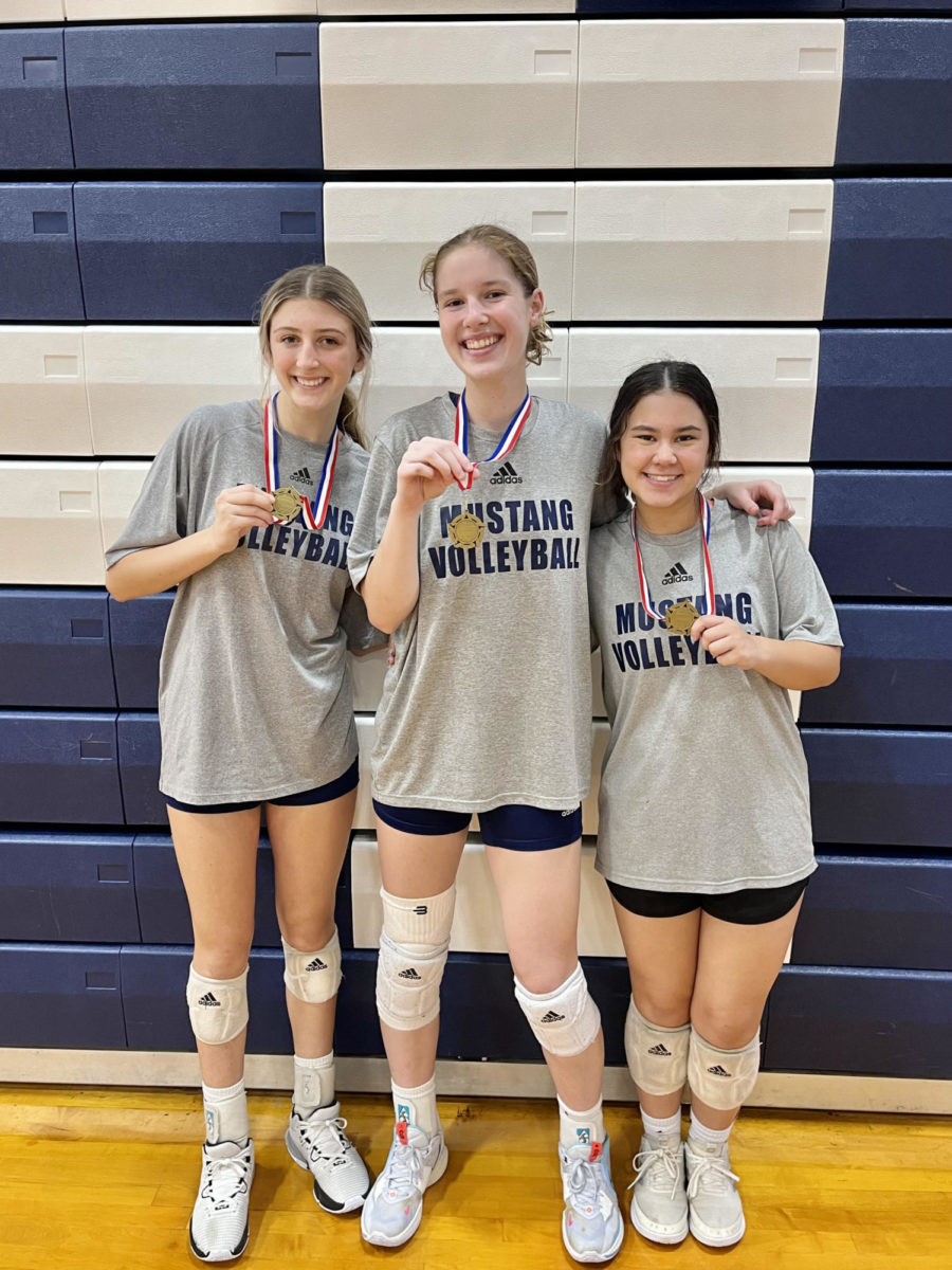Junior Kadence Ackmann (right) Senior Kaylin Starling (middle) and Junior Mia Gunn all pose for a picture after earning all tournament team.