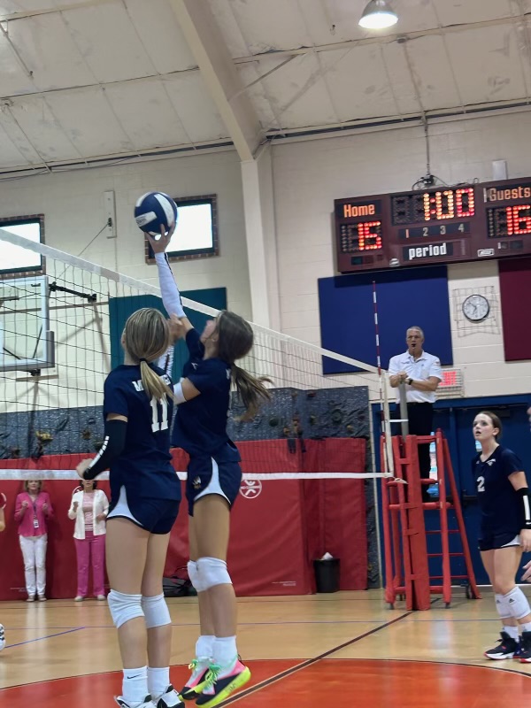 Eighth graders Brittany Bartoo and Elizabeth Thompson go up for the block.