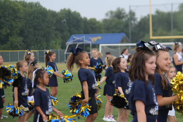 The Lil Stangs cheer team performs their routine during tailgate. 
