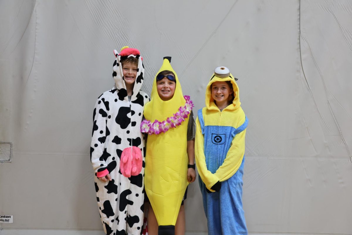 7th graders Jack Nordhaus, Mason McAnally, and Sara Radtke pose for a picture on Wacky Wednesday.