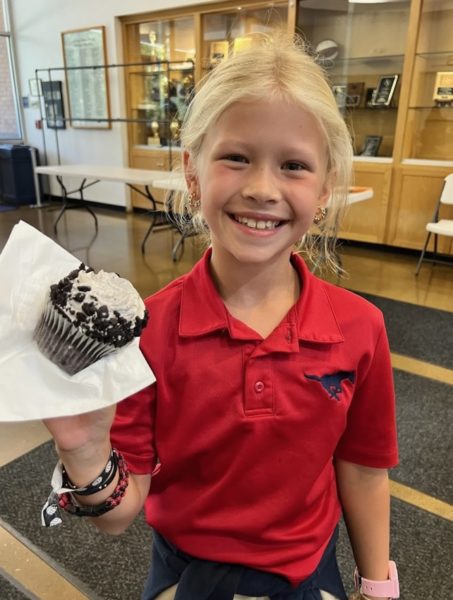 Second grader Tindyl Barnard shows off her cupcake. 