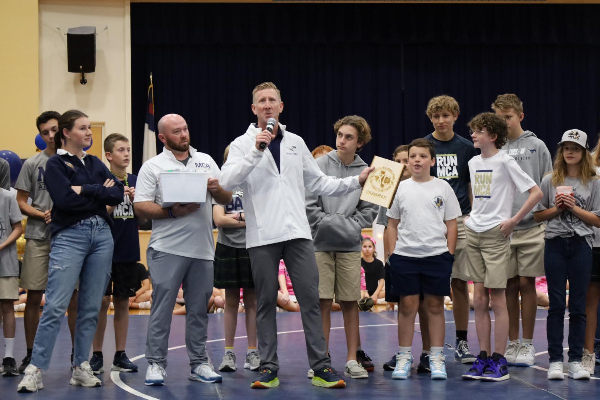 Middle School Cross Country gets recognized for winning state.
