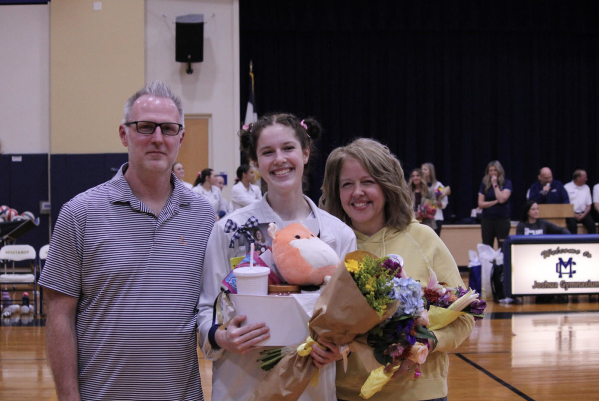 Senior Kaylin Starling stands next to her parents as she is announced