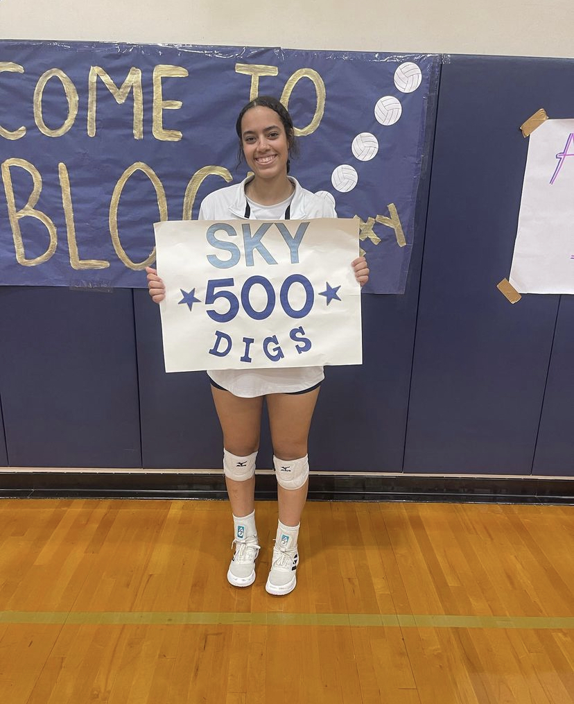 Senior Sky Miller gets her 500th career dig.