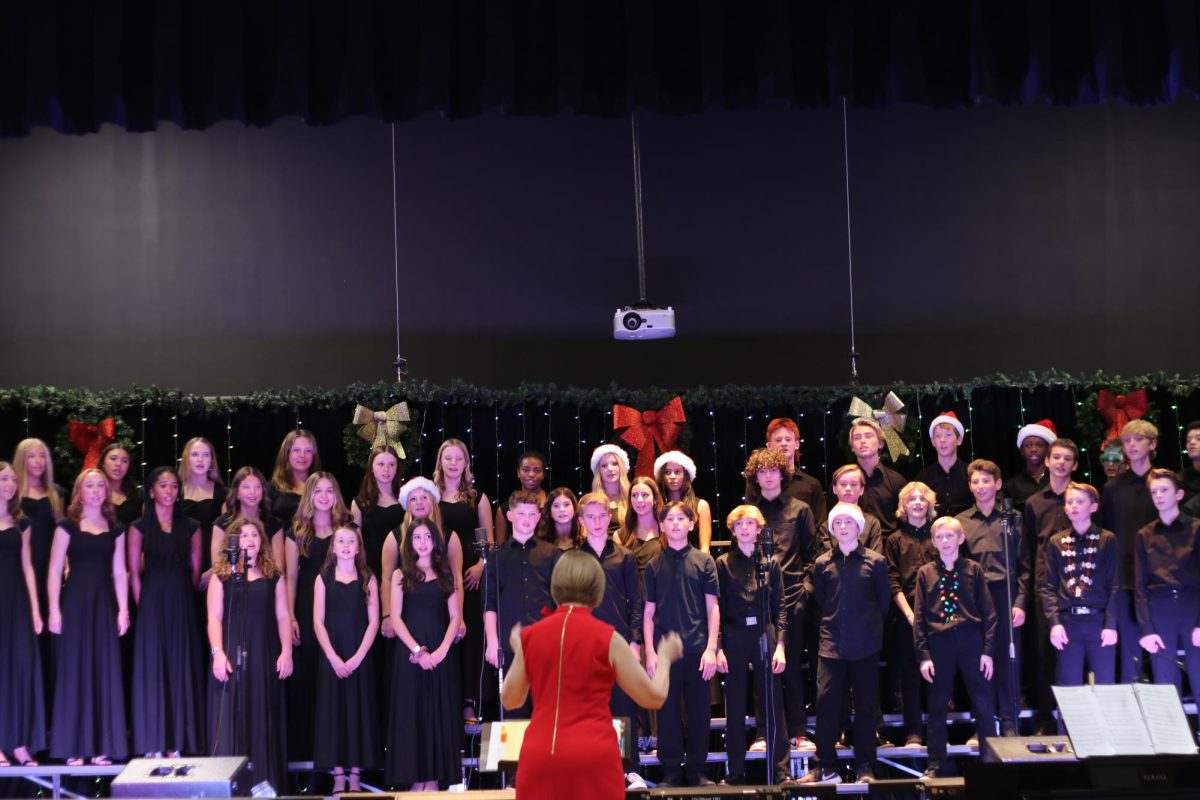 Middle School choir sings during the Fine Arts Winter performance. 