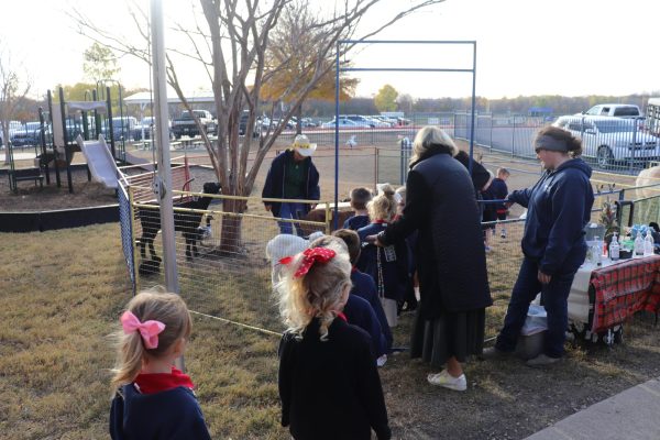 Lower School students line up for the petting zoo.