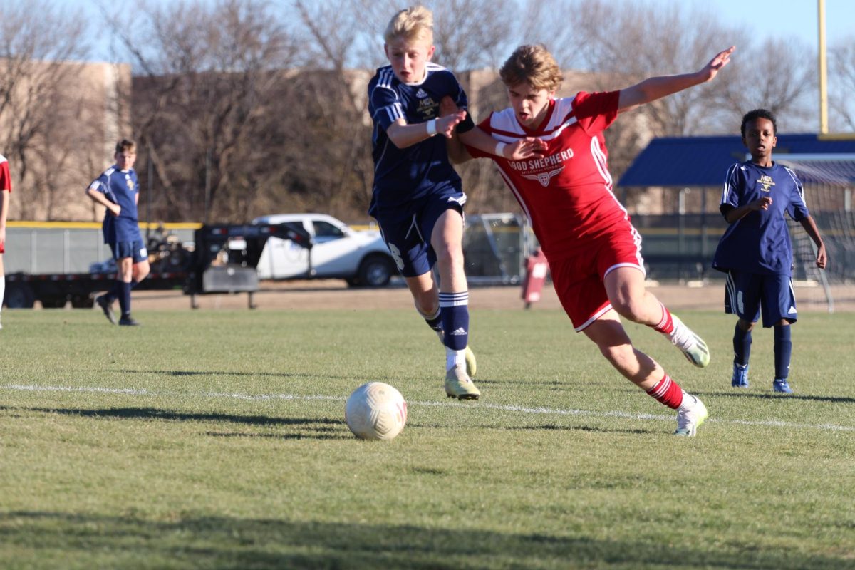 Sixth grader Trase Ackmann gets past the defender.