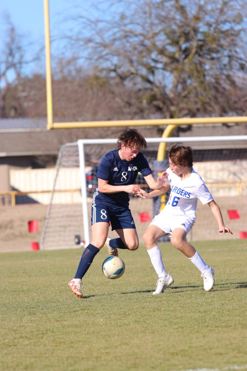 Sophomore Grady Rogers fights for the ball 