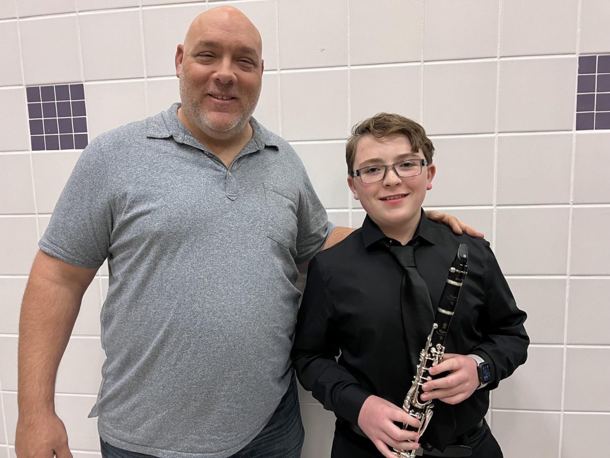 Band director Ken Snow and Silas Urban after a performance.