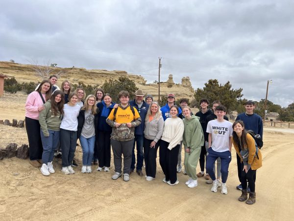 New Mexico group takes picture in front of mission.