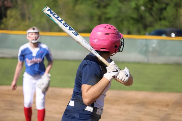 Eighth grader Isabella Melton gets ready to hit the ball.