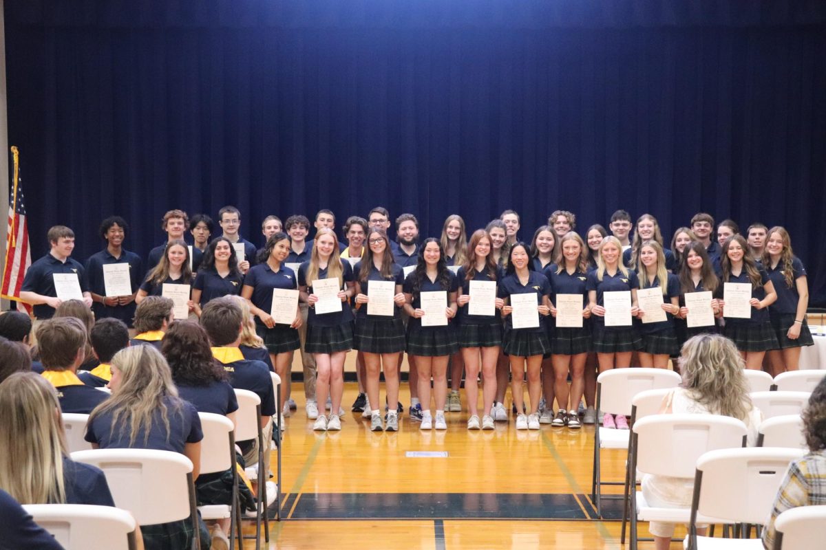 The NHS inductees pose for a photo at the end of the induction.