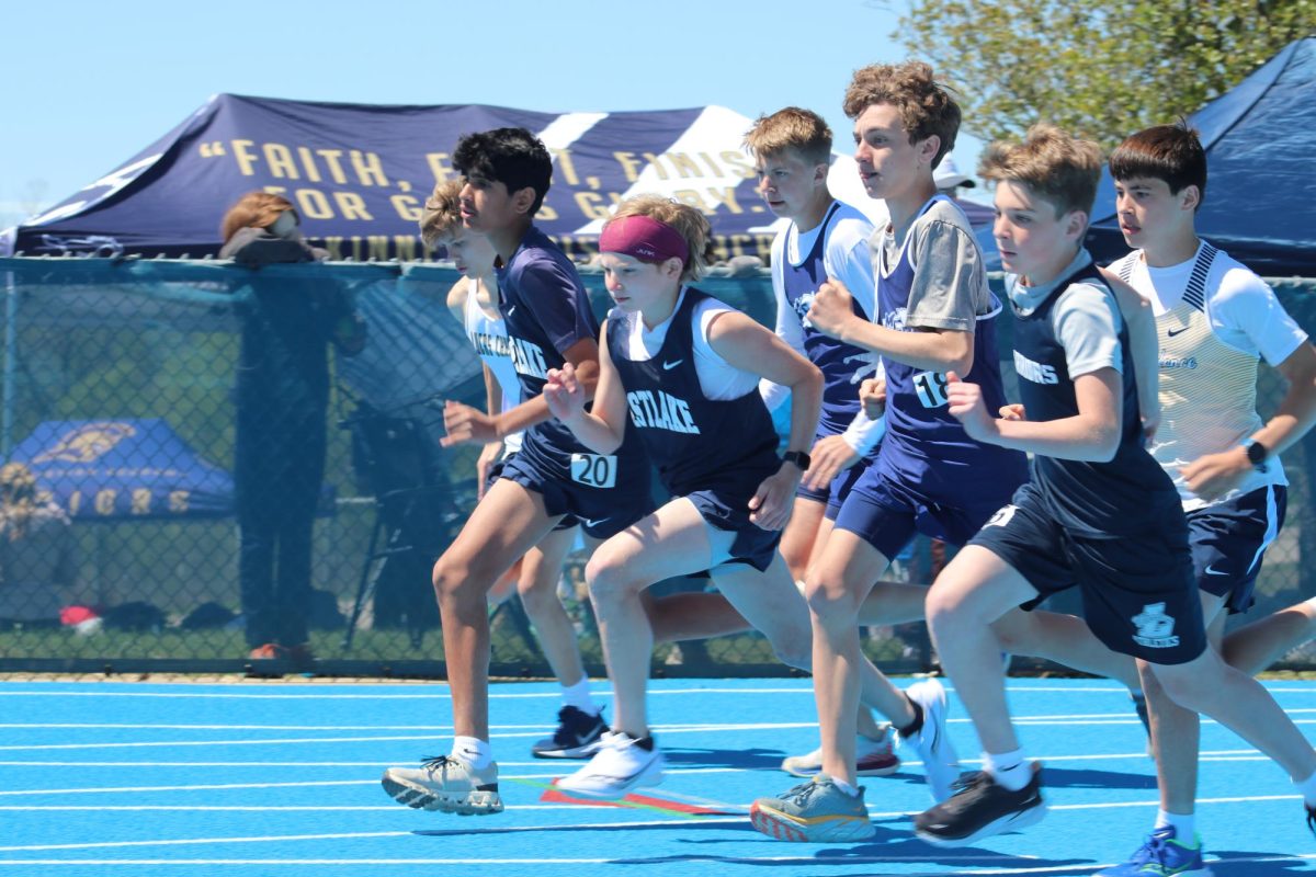 Seventh Graders racing around the track