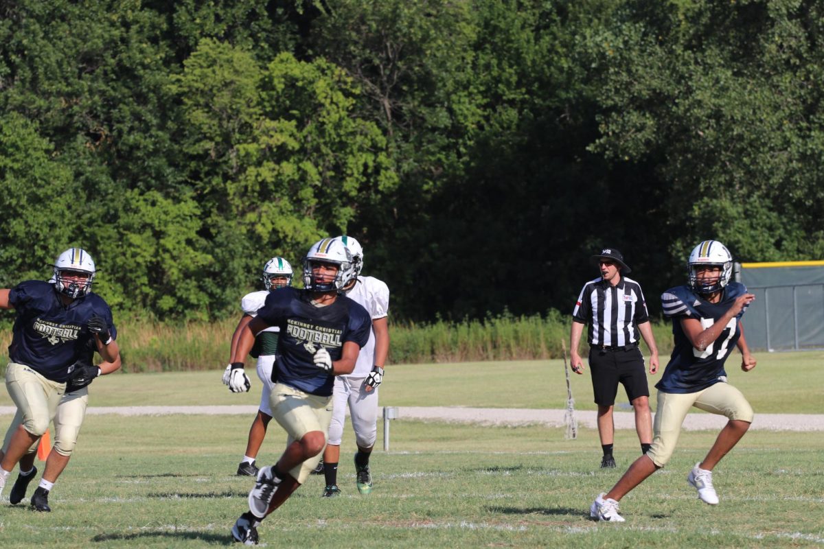 The receivers track down the ball.