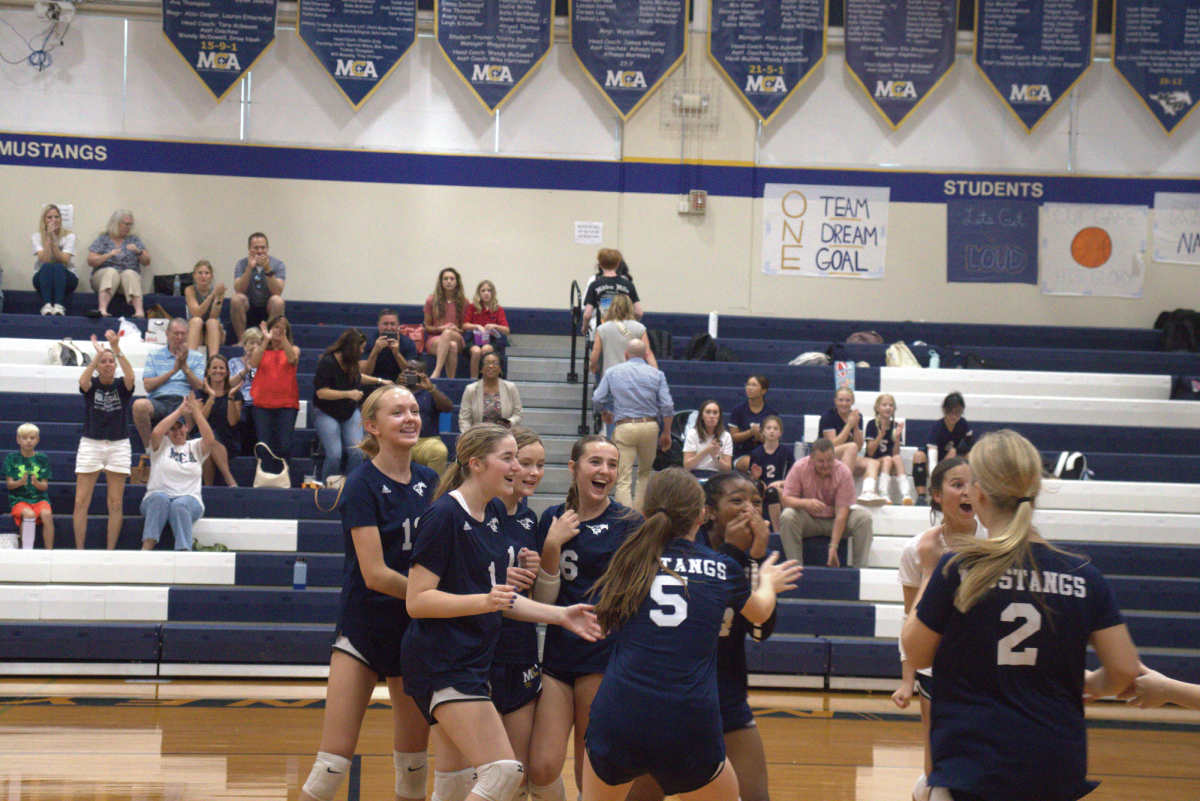 The team celebrates after well fought match.