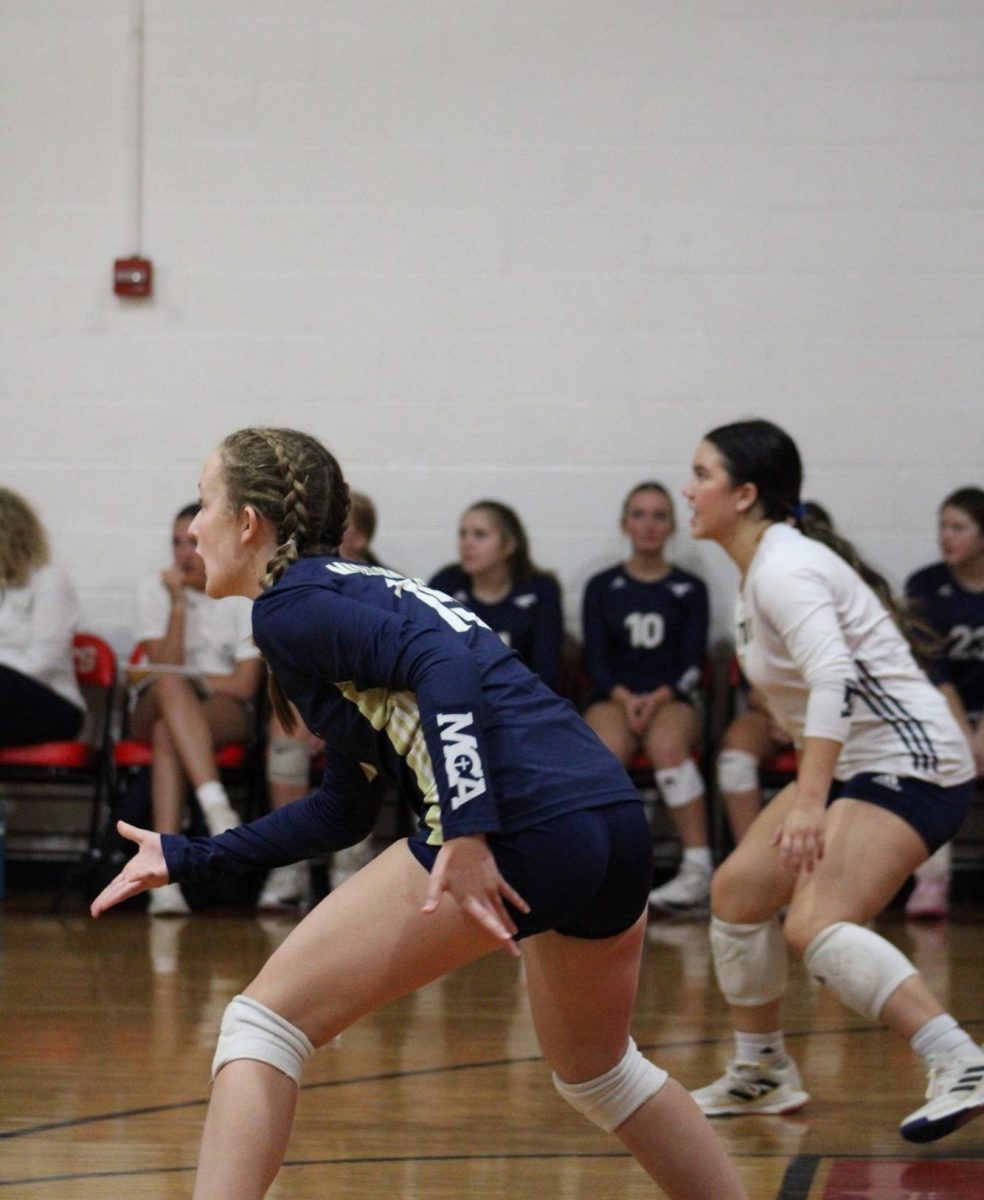 Sophomore Tristyn Vineyard and senior Mia Gunn get ready to pass the ball.