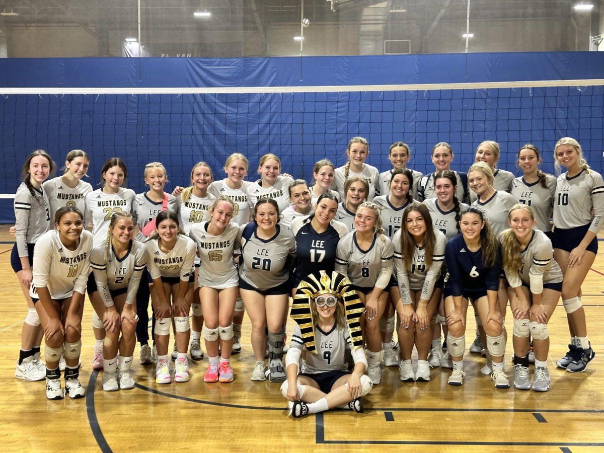 After getting the win, the Mustangs take a picture with their supporting team that was cheering them on.