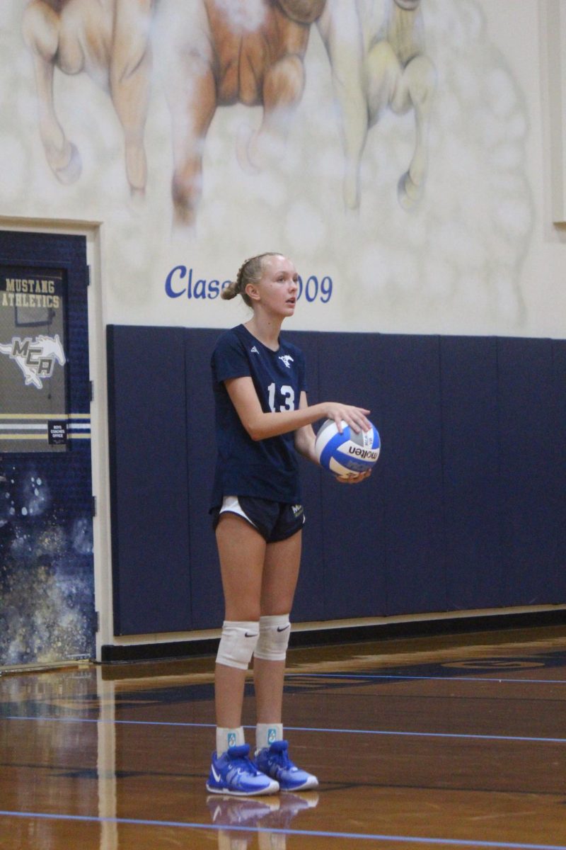 Eighth grader Berkley Ballew contemplates where she is going to place her next serve.