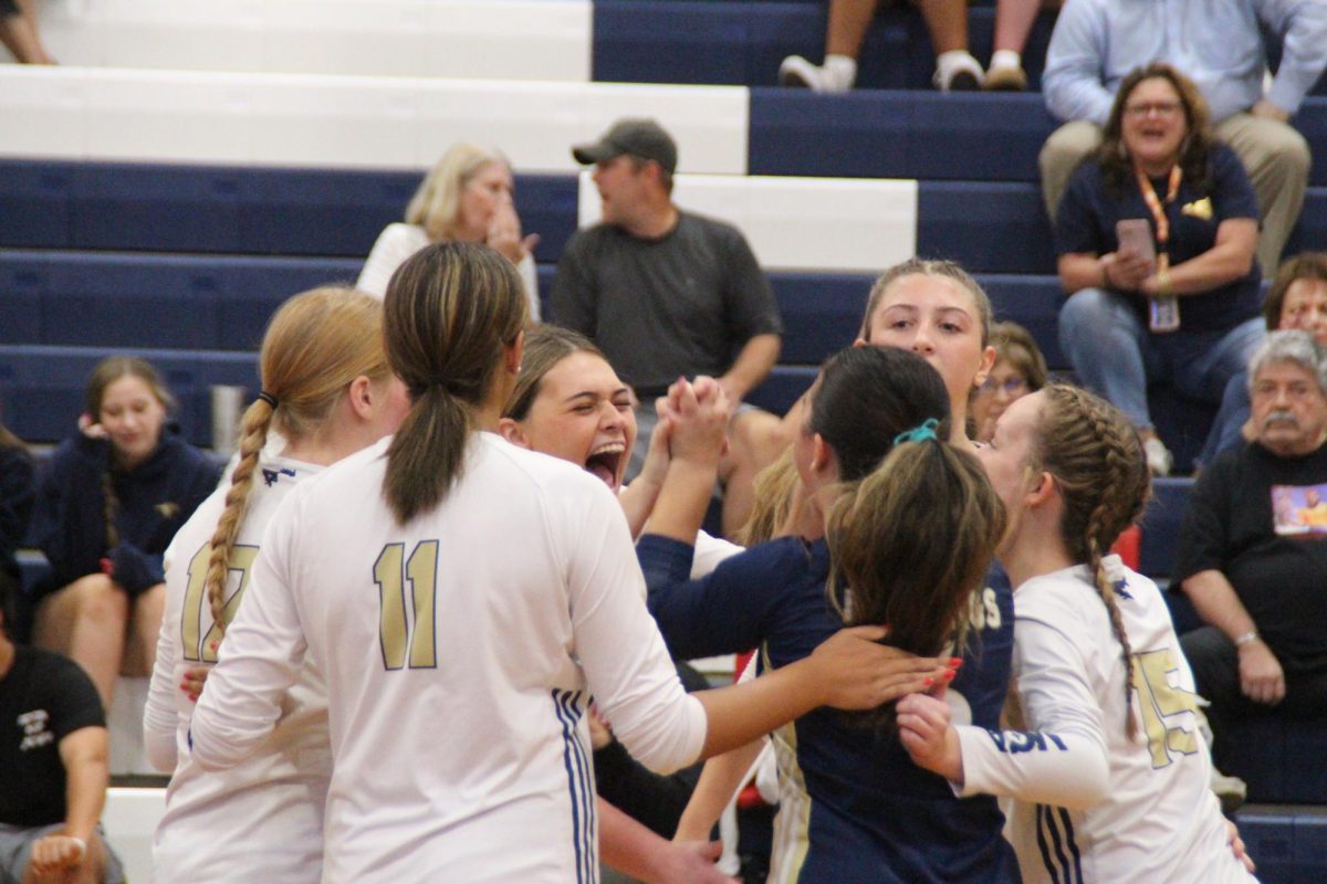 The Lady Mustangs get hyped after winning a point.