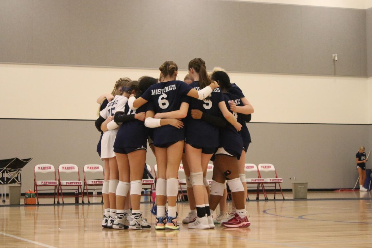 The Middle School D1 huddles up before the game.