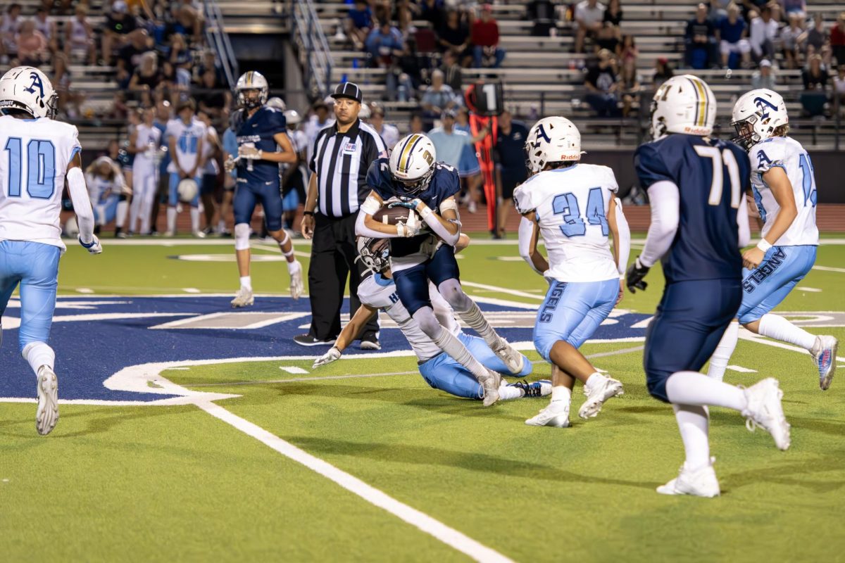 The Angels try to stop one of the Mustang runners. 