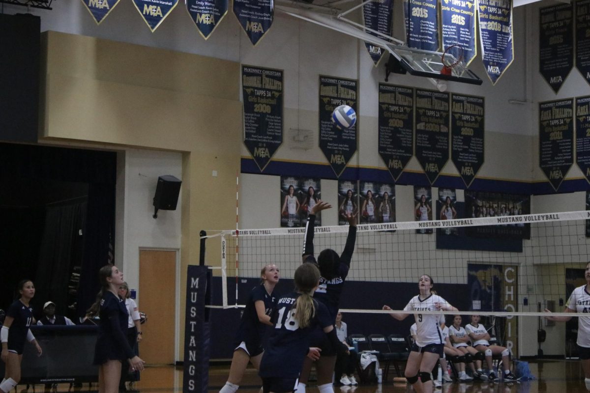 Eighth grader Berkley Ballew gets ready to spike the ball.