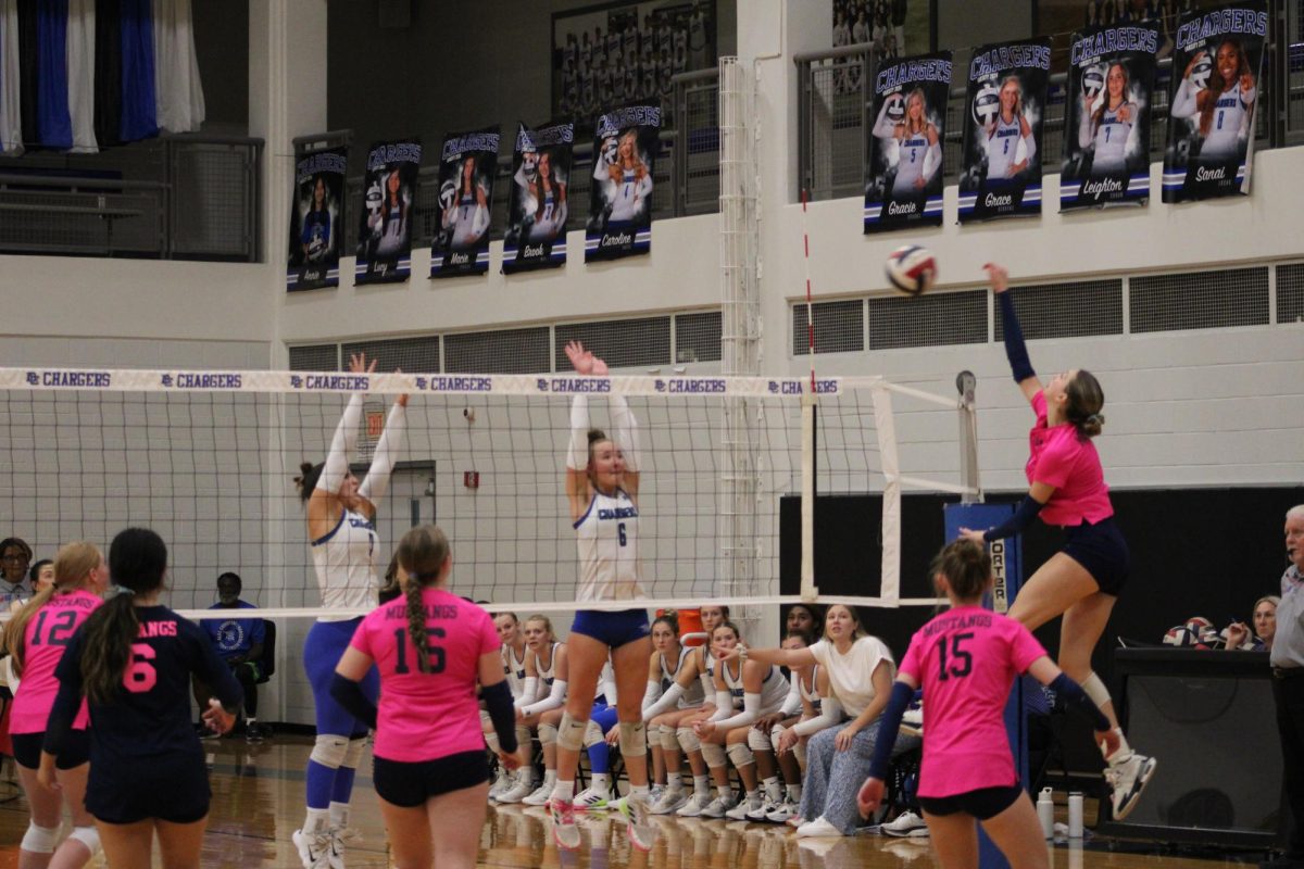 Senior Kadence Ackmann jumps high and gets a kill.