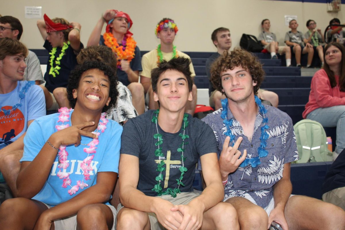 Cody Dow, Adam Gicheru, and Manny at the pep rally.