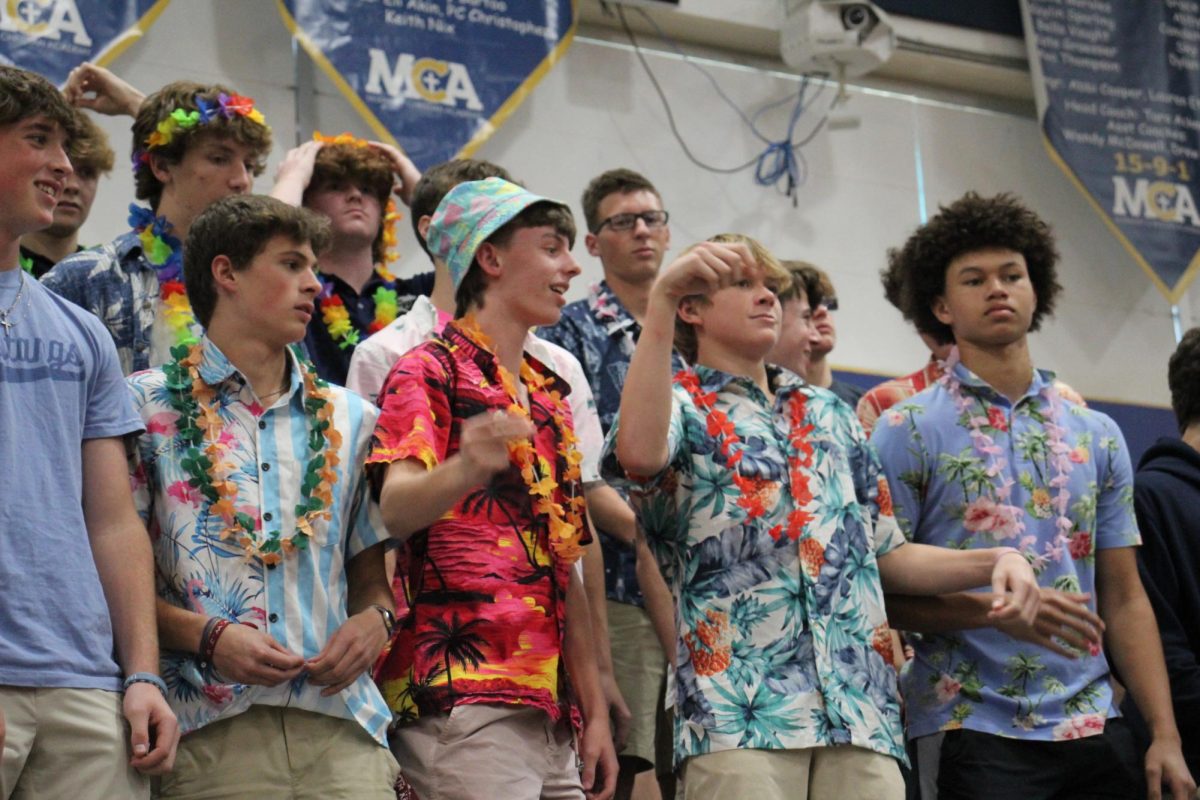 Sophomore boys cheer during the pep rally