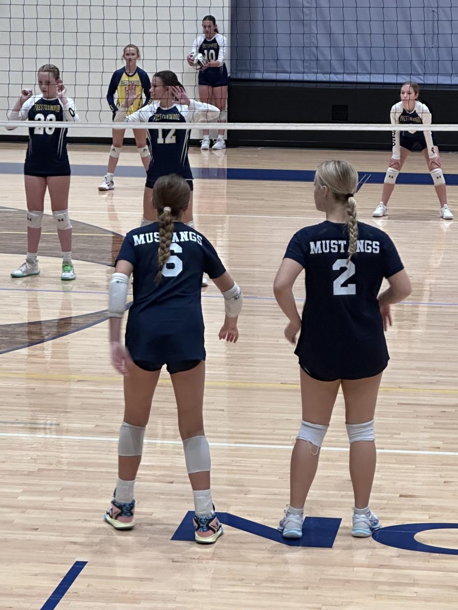 Eighth graders Kate Thomas and Marlee DePetris get ready to pass.  