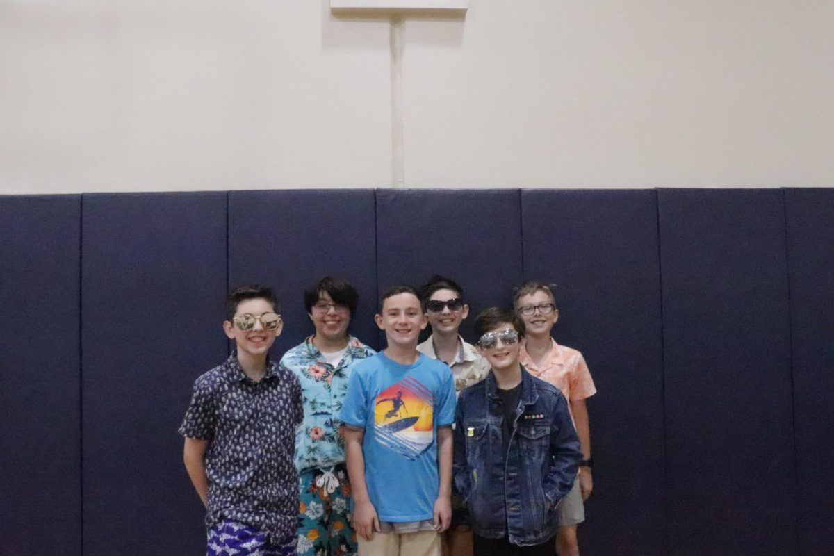 6th grade boys dress up and take a picture together during amplify week