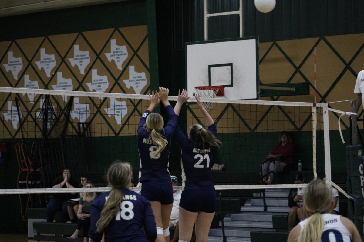 Freshmen Tatum Carroll gets up on the block