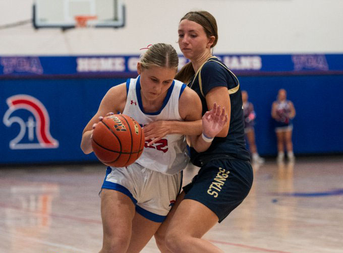 Freshman, Elizabeth Thompson, fights for the ball.