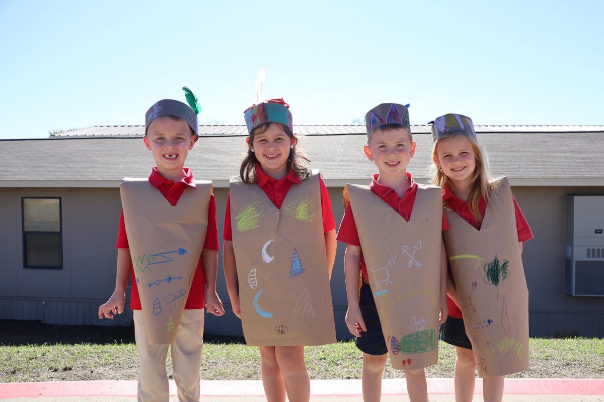 Kindergarteners, Stoleigh Cantu, Sawyer James, Mollie Kietzke, and Everett Rudd pose for a picture.