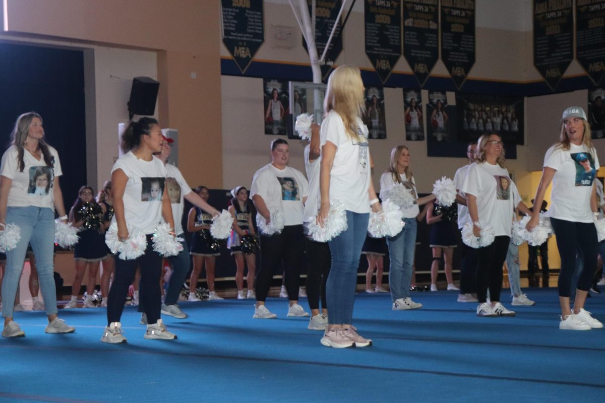 Senior parents perform a cheer dance