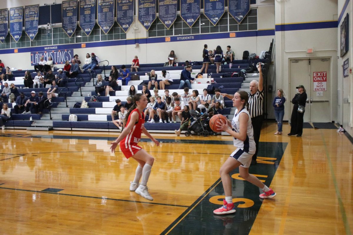 Eighth Grader Kate Thomas passes the ball. 