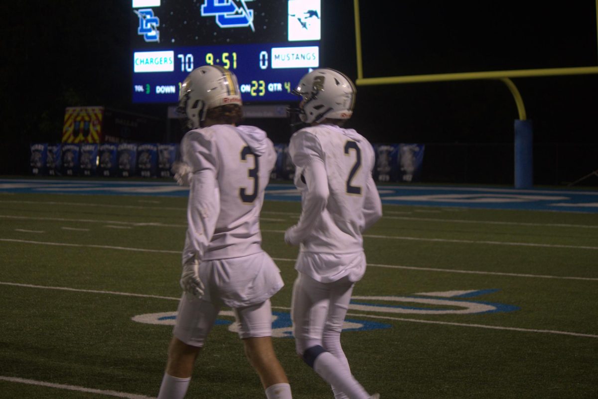 Sophomores Harry Thompson and Lincoln Pogue get ready for the game.