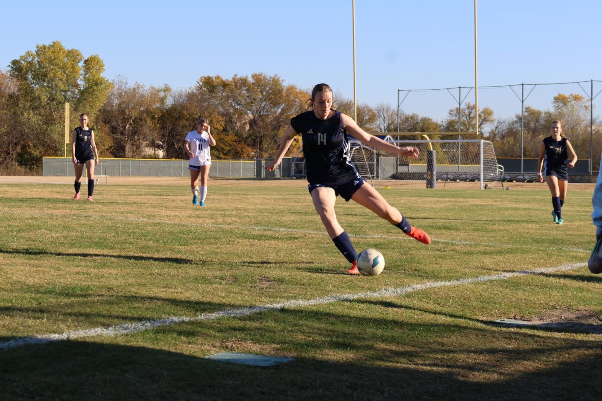 Junior Sadie Blake passes the ball down the line. 