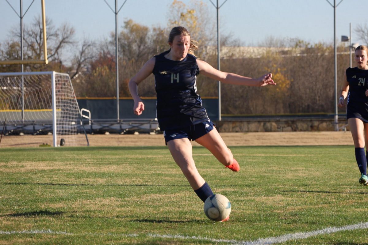 Junior Sadie Blake strikes the ball.