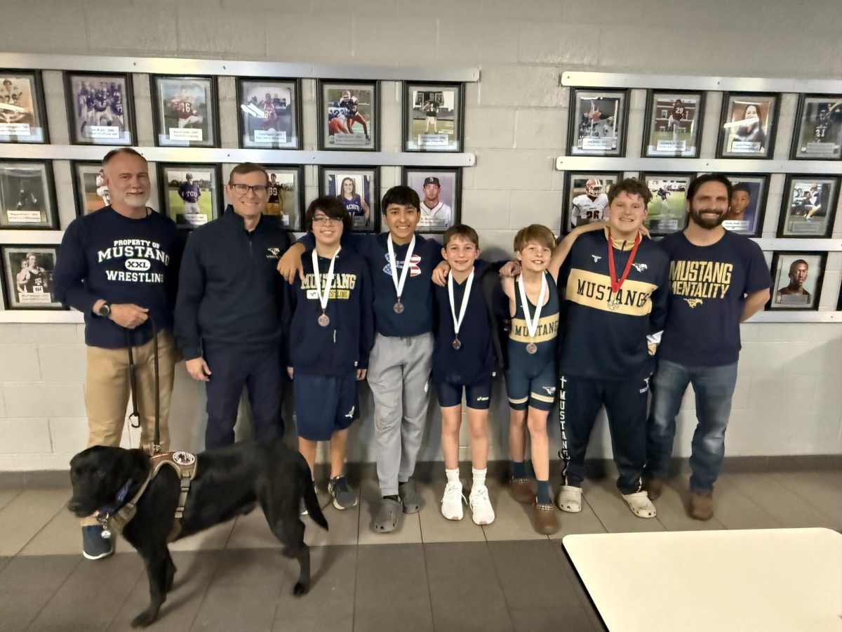 Middle School wrestlers gather for a picture.