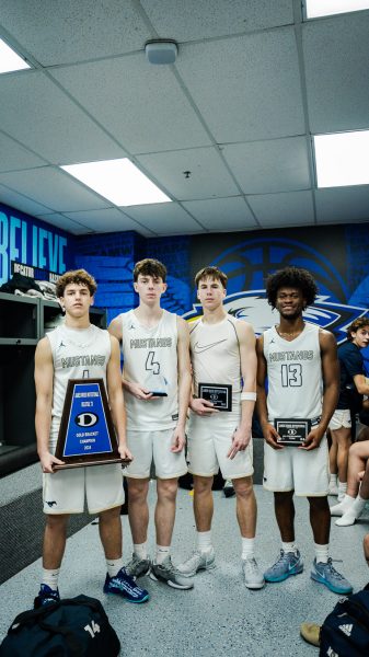 The seniors take a picture with the trophy after the championship.