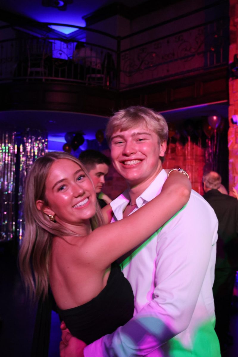 Seniors Ellie Neeman and Jude Westra slow dance together. 