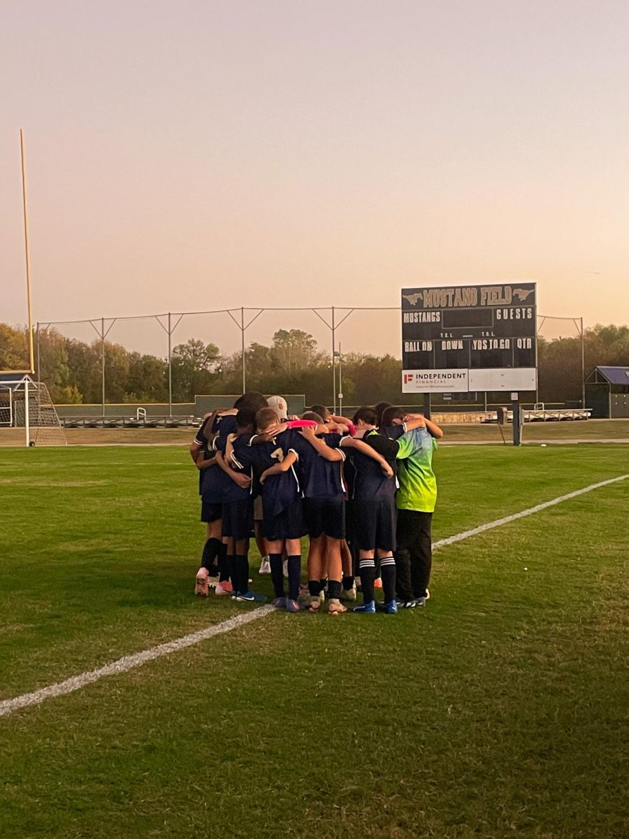 The team Praying after a hard fought game