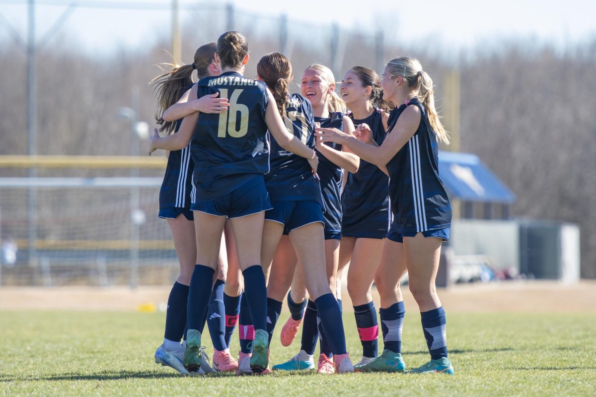 Team celebrates after scoring a goal.