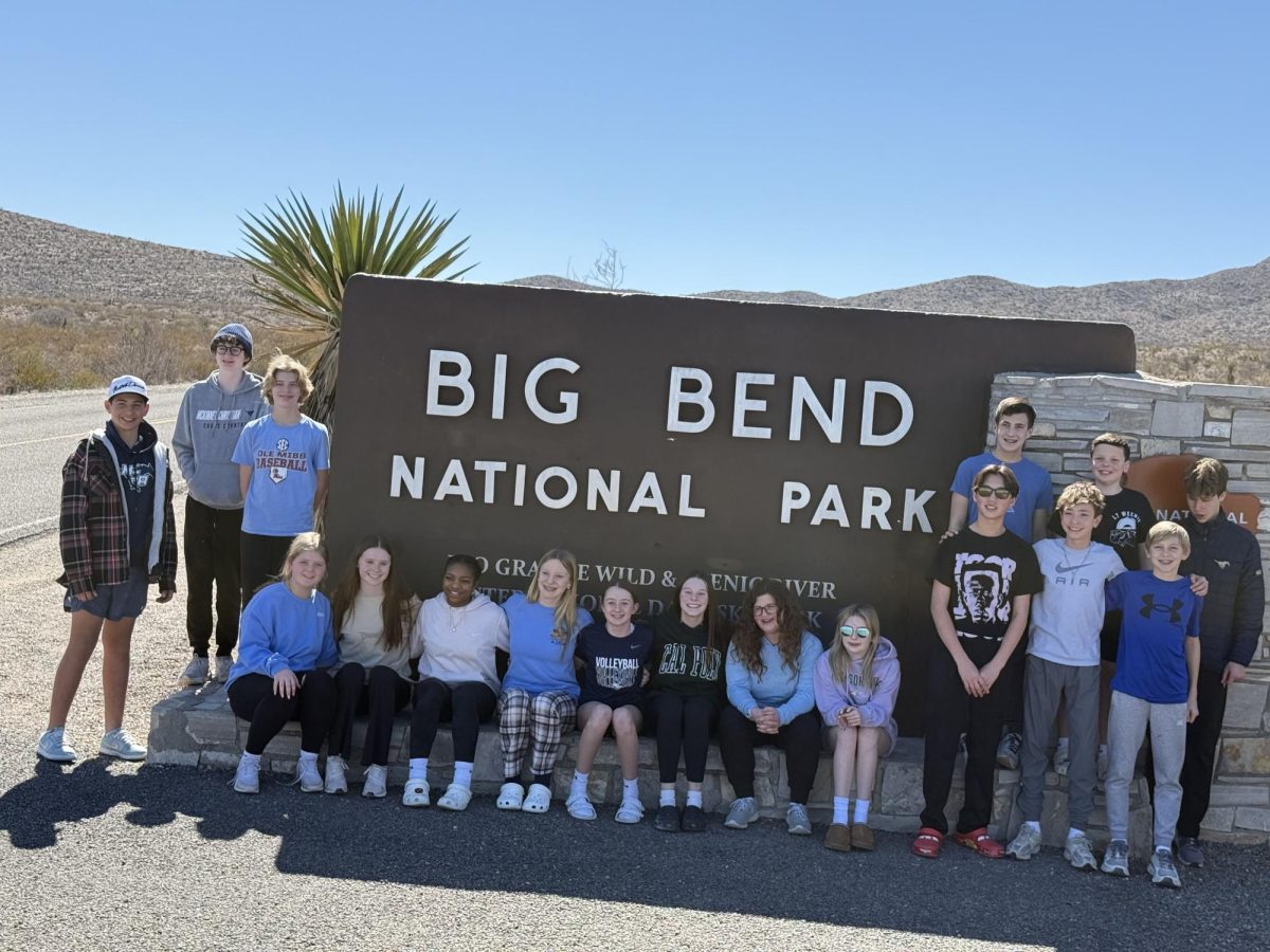 The class takes a photo when driving into Big Bend National Park.