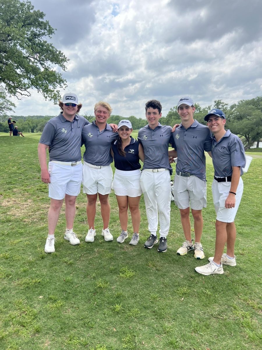The boys golf team poses for a picture before they compete. 