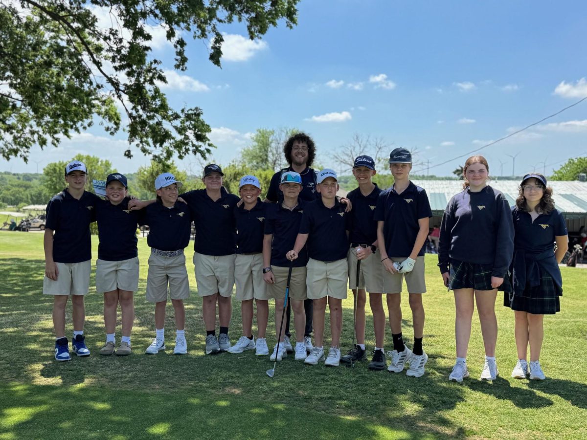 The golf team stands for the picture.