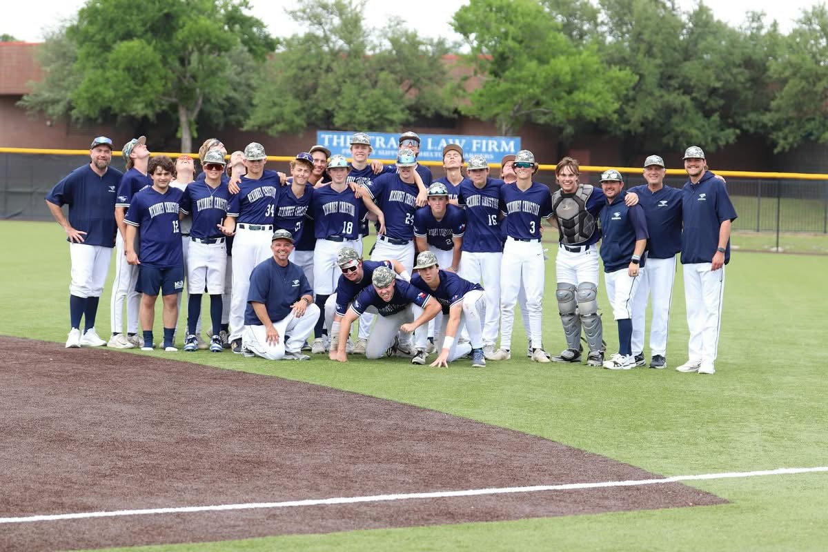 The Mustangs take a team photo after the game.