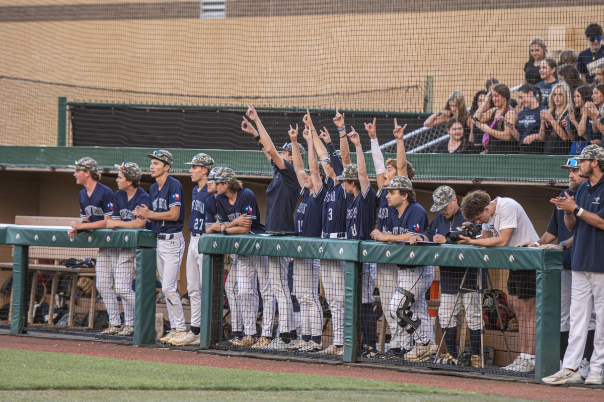 The dugout cheers on their team as the Mustangs inch closer to the title.
